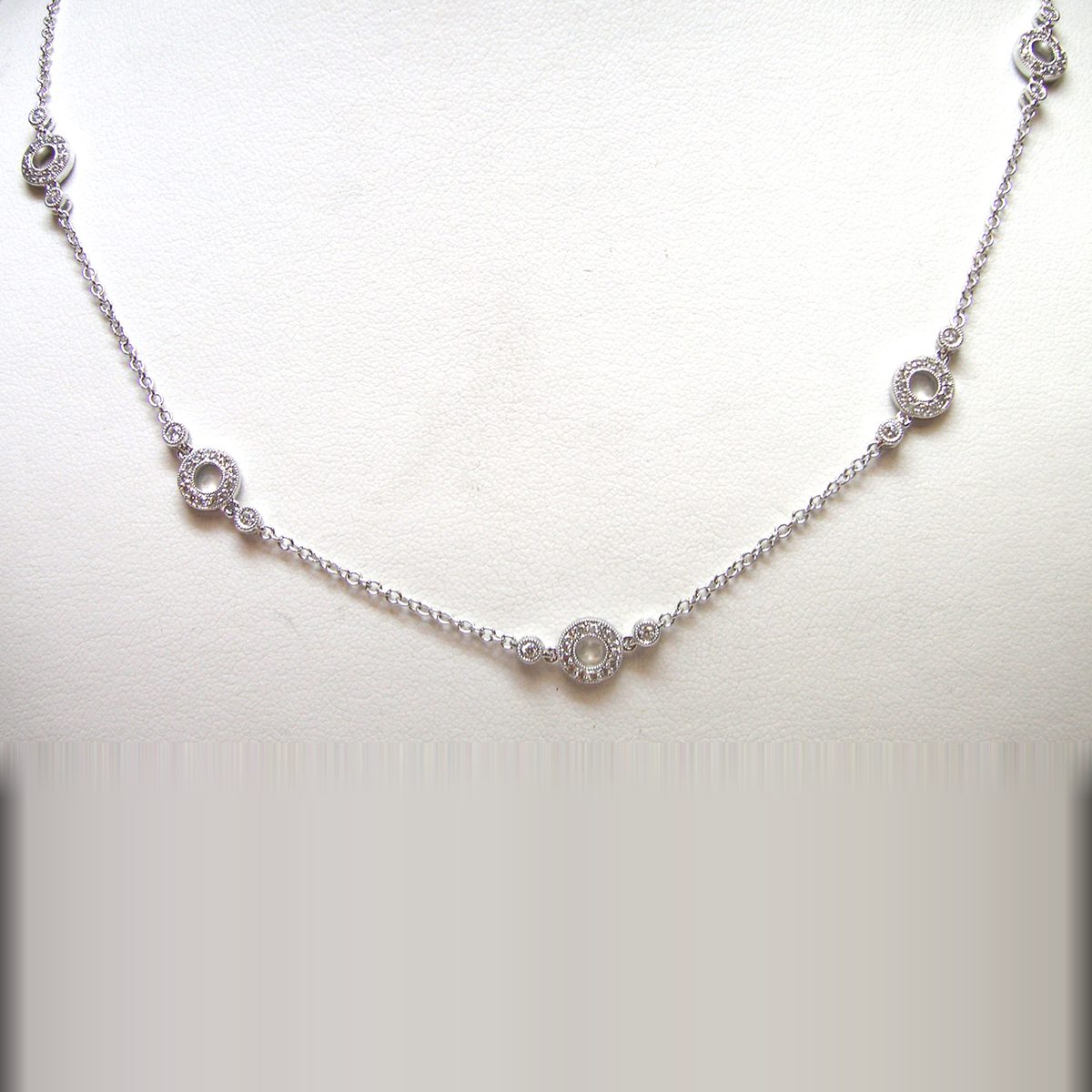 White gold diamond station necklace with pave circle links