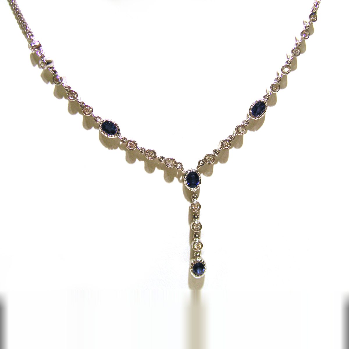 Sapphire and diamond necklace with an oval sapphire Y drop