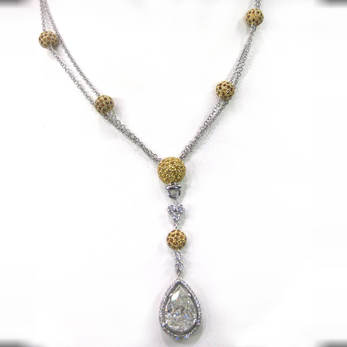 Pear shape diamond drop necklace with yellow sapphire pave beads